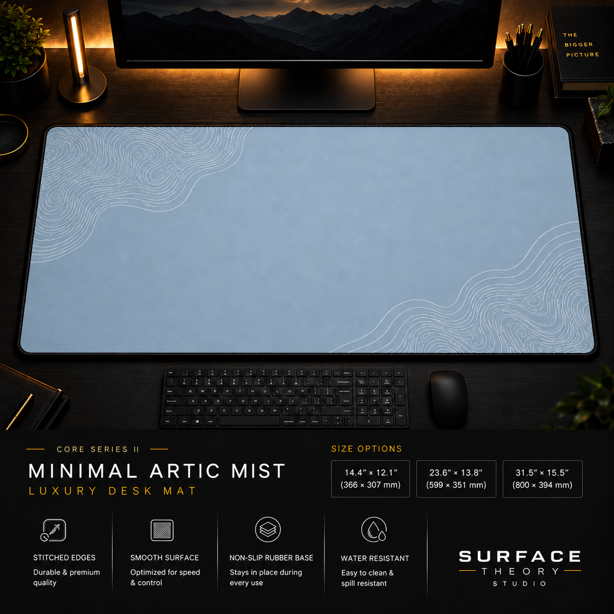 Minimal Artic Mist desk mat in a dark workstation with warm monitor lighting.