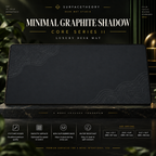 Minimal Graphite Shadow desk mat on a studio display with size and product information.
