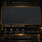 Minimal Graphite Shadow desk mat in a gold-toned showcase frame above a keyboard.