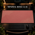 Minimal Rose Clay desk mat in a warm, dark workspace.
