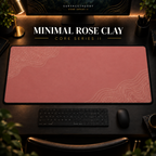 Minimal Rose Clay desk mat in a warm, dark workspace.