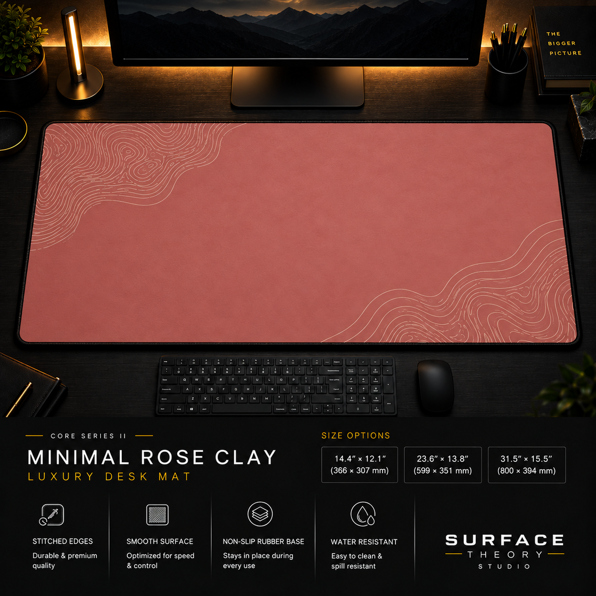 Minimal Rose Clay desk mat in a dark workstation with warm monitor lighting.