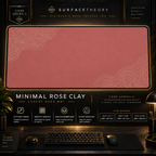 Minimal Rose Clay desk mat in a gold-toned showcase frame above a keyboard.