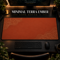 Minimal Terra Ember desk mat in a warm, dark workspace.