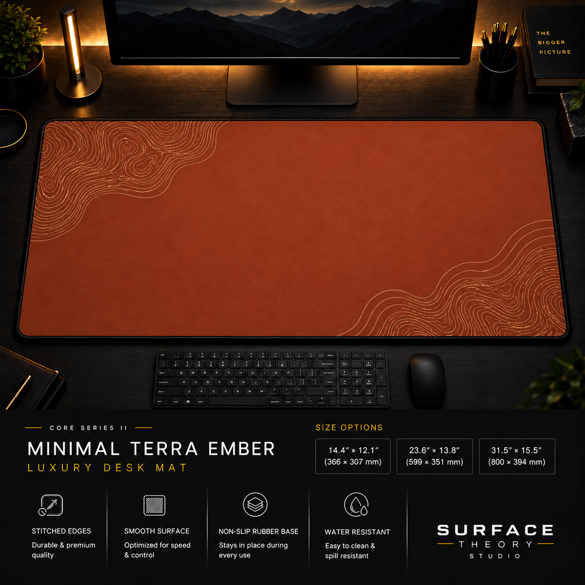 Minimal Terra Ember desk mat in a dark workstation with warm monitor lighting.