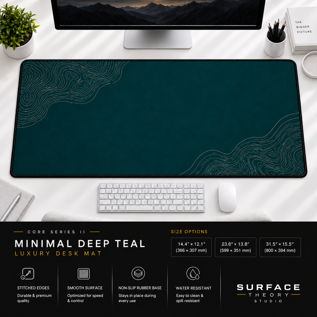 Minimal Deep Teal desk mat beneath a monitor on a bright desk with a white keyboard and mouse.
