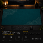 Minimal Deep Teal desk mat in a dark workstation with warm monitor lighting.