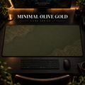 Minimal Olive Gold desk mat in a warm, dark workspace.
