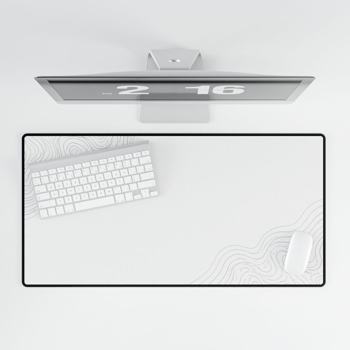 Overhead view of Minimal White desk mat beneath a keyboard and mouse on a white desk.