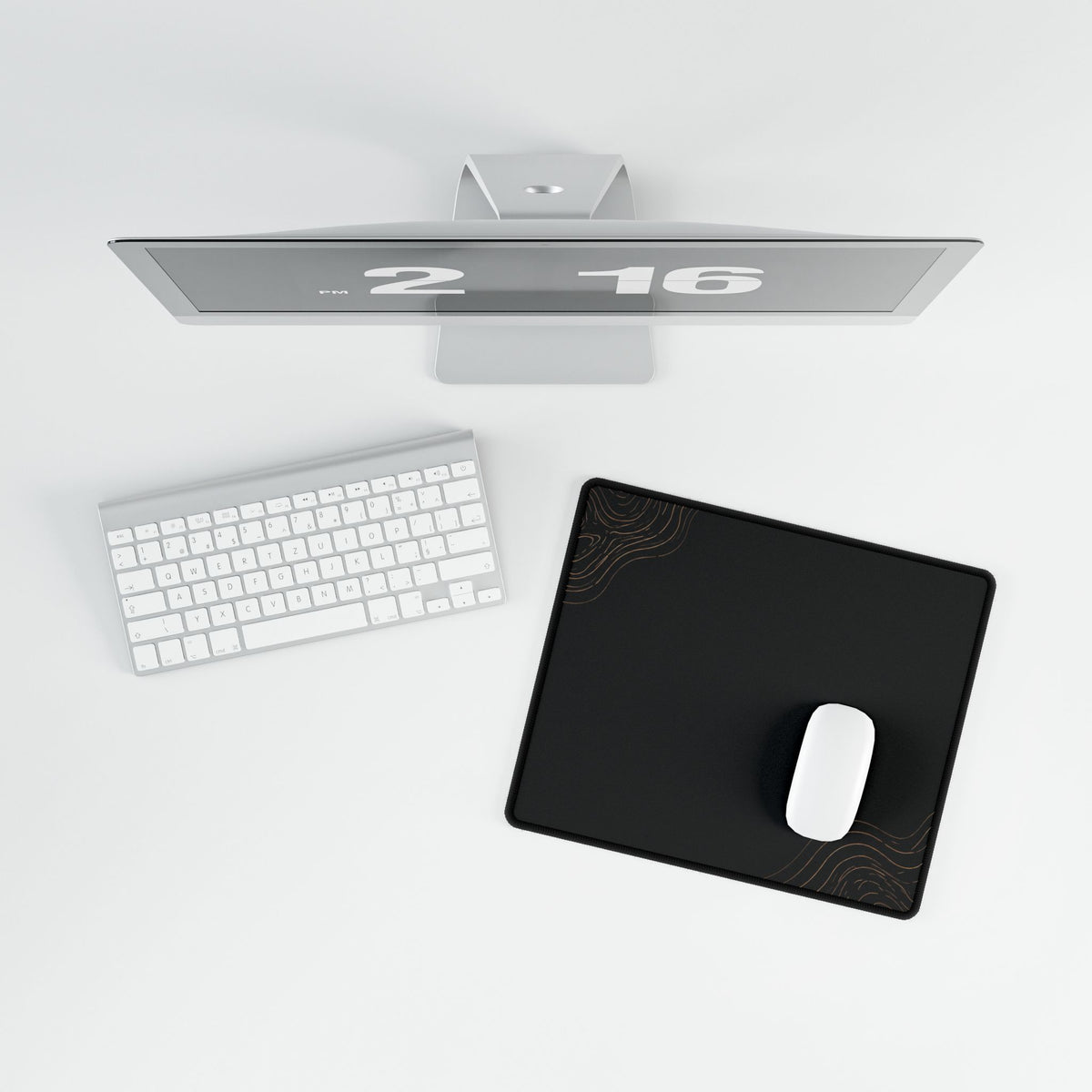Overhead view of Minimal Black compact desk mat with a mouse beside the keyboard.