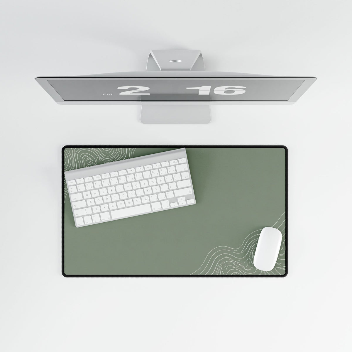 Overhead view of Minimal Green medium-format desk mat on a white desk.