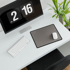 Minimal Stone Grey compact desk mat with a mouse beside a white keyboard, viewed at an angle.