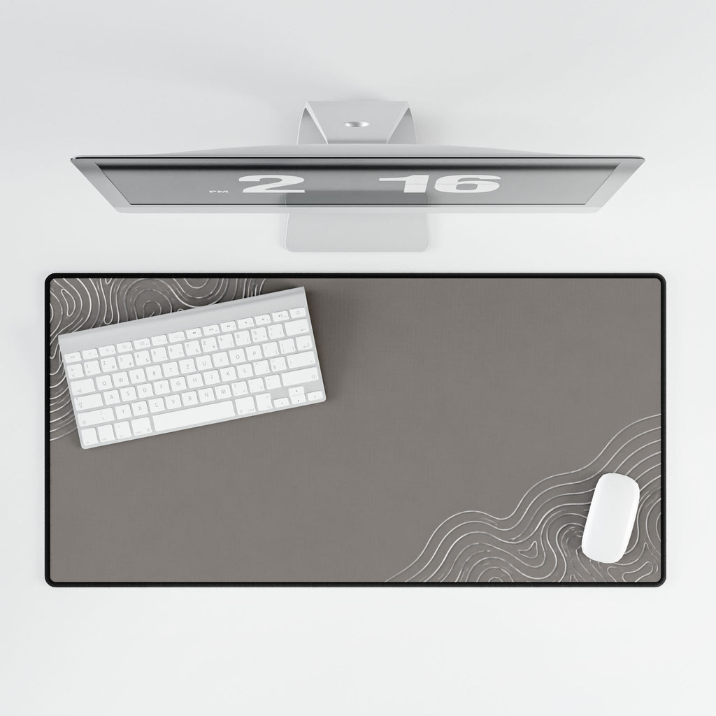 Overhead view of Minimal Stone Grey desk mat beneath a keyboard and mouse on a white desk.