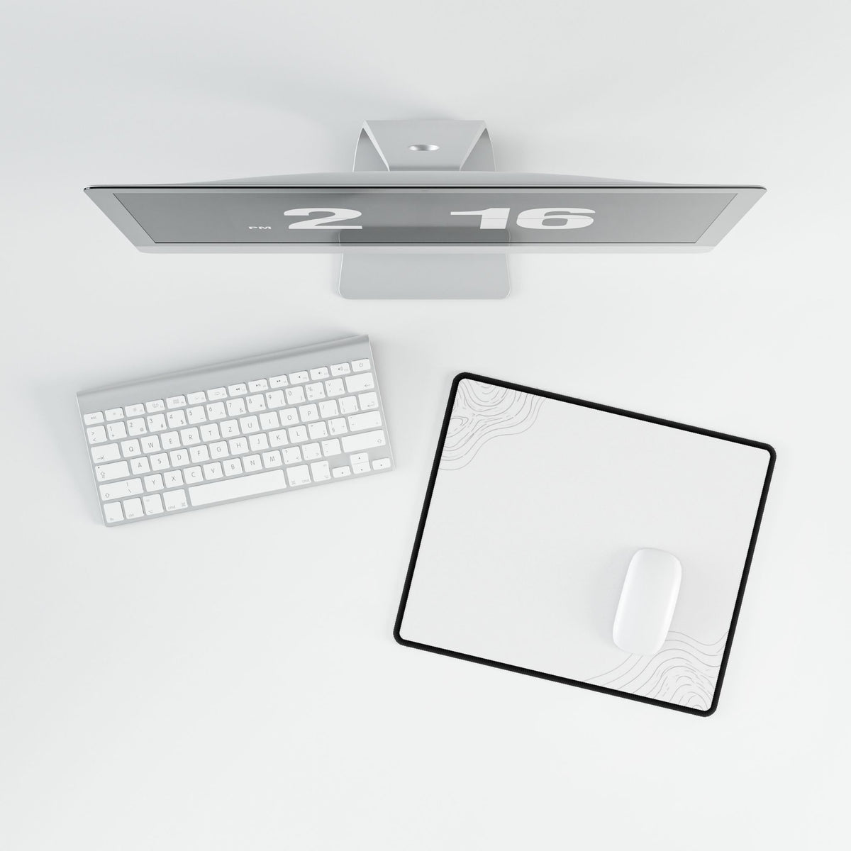 Overhead view of Minimal White compact desk mat with a mouse beside the keyboard.