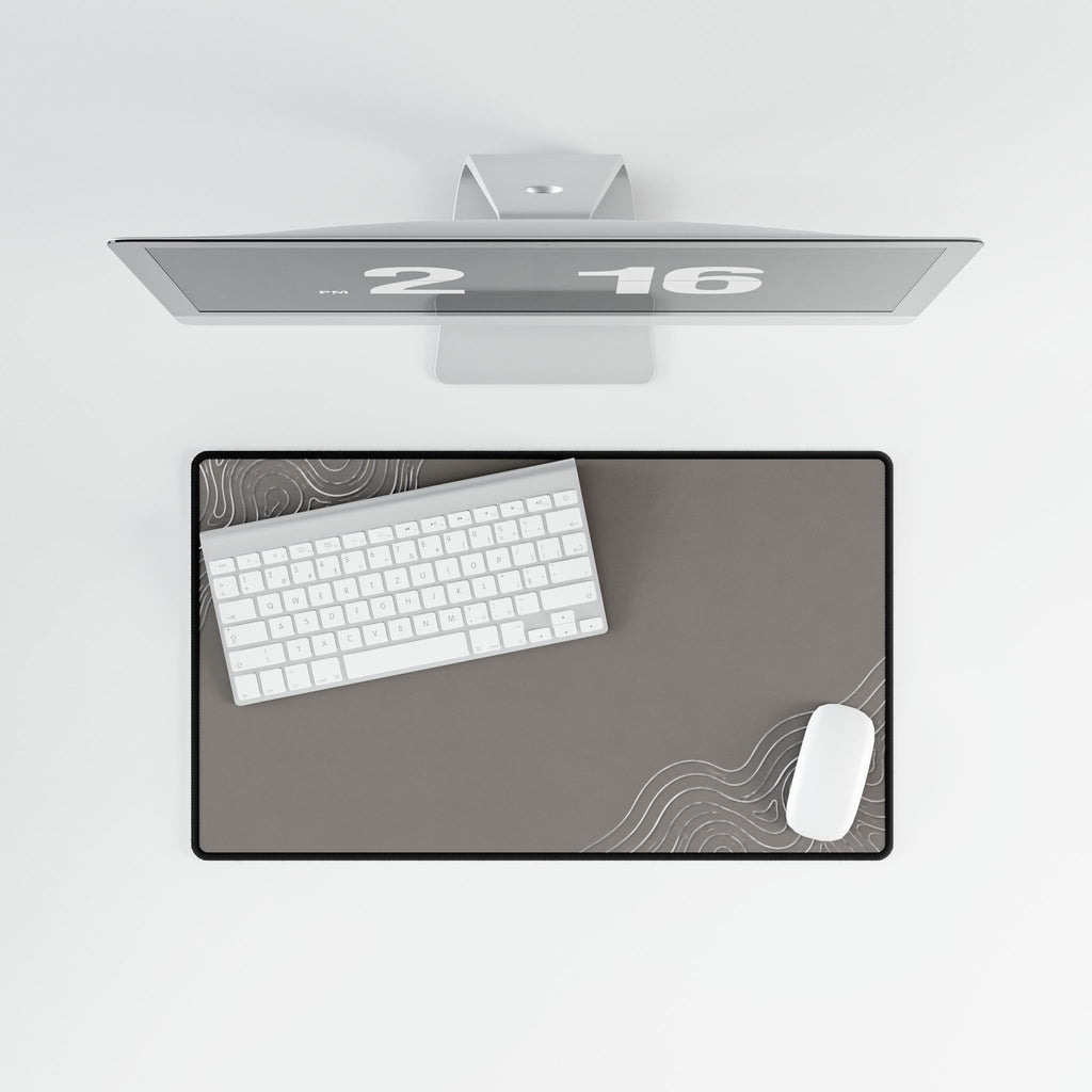 Overhead view of Minimal Stone Grey medium-format desk mat on a white desk.