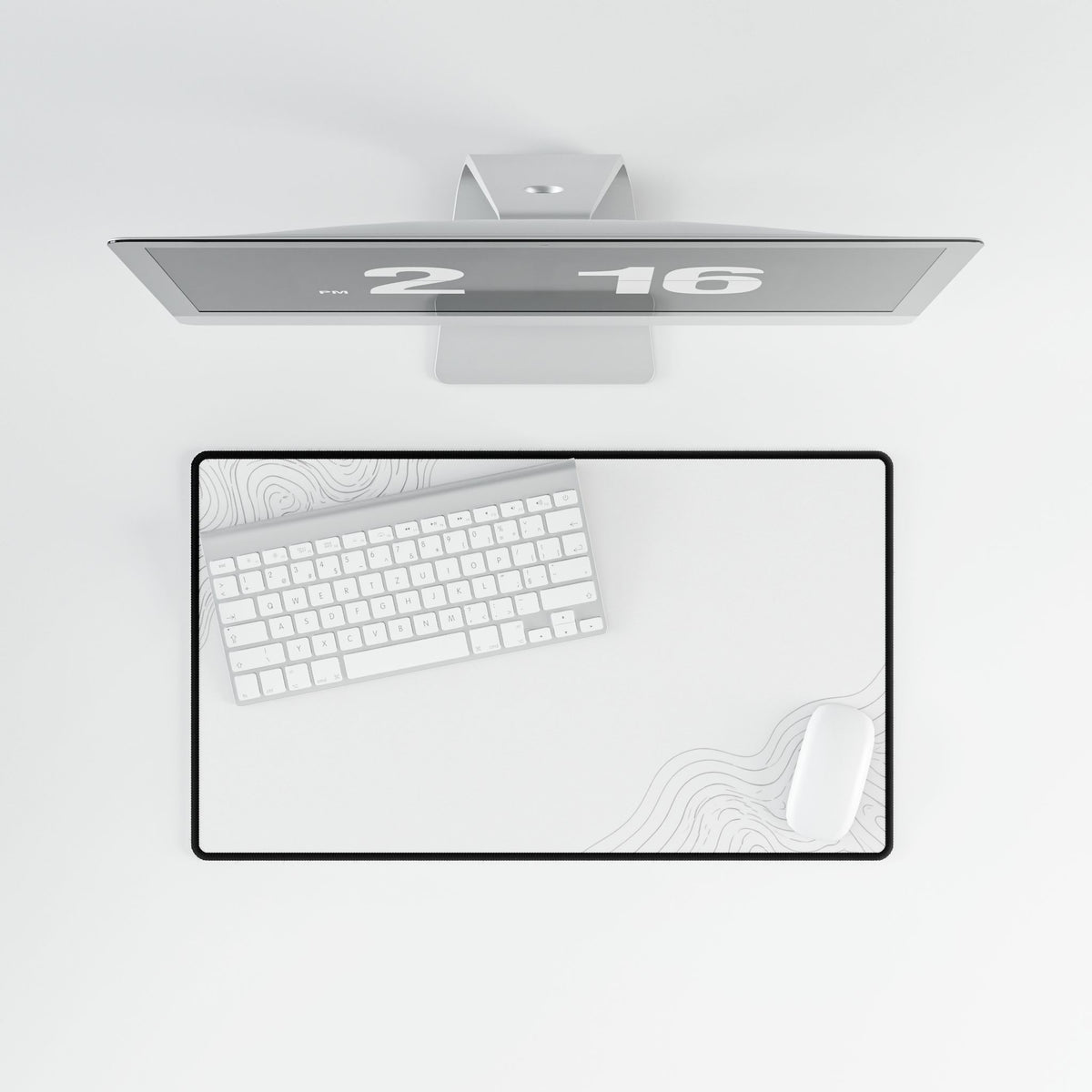 Overhead view of Minimal White medium-format desk mat on a white desk.