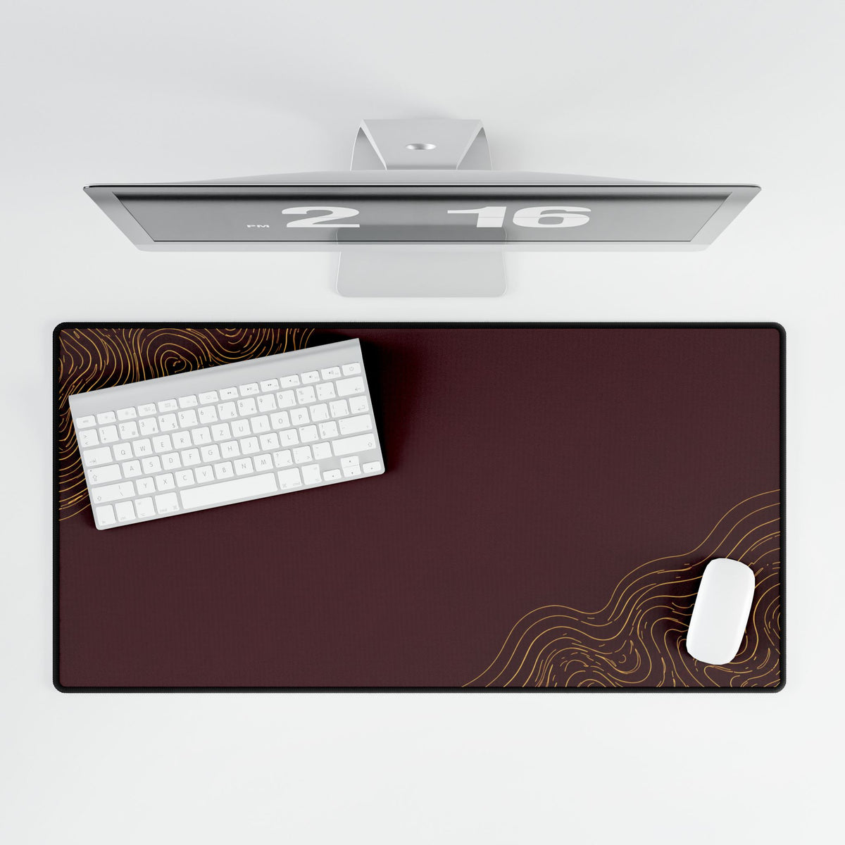 Overhead view of Minimal Burgundy desk mat beneath a keyboard and mouse on a white desk.